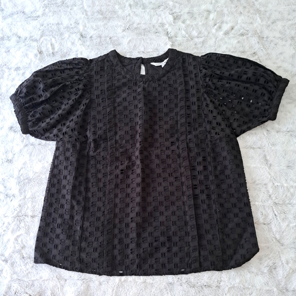 Elizabeth and James black lined cutouts blouse shirt. Size M.